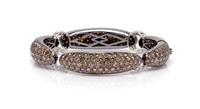 An 18 Karat White Gold, Colored Diamond and Diamond Bracelet, 30.10 dwts.