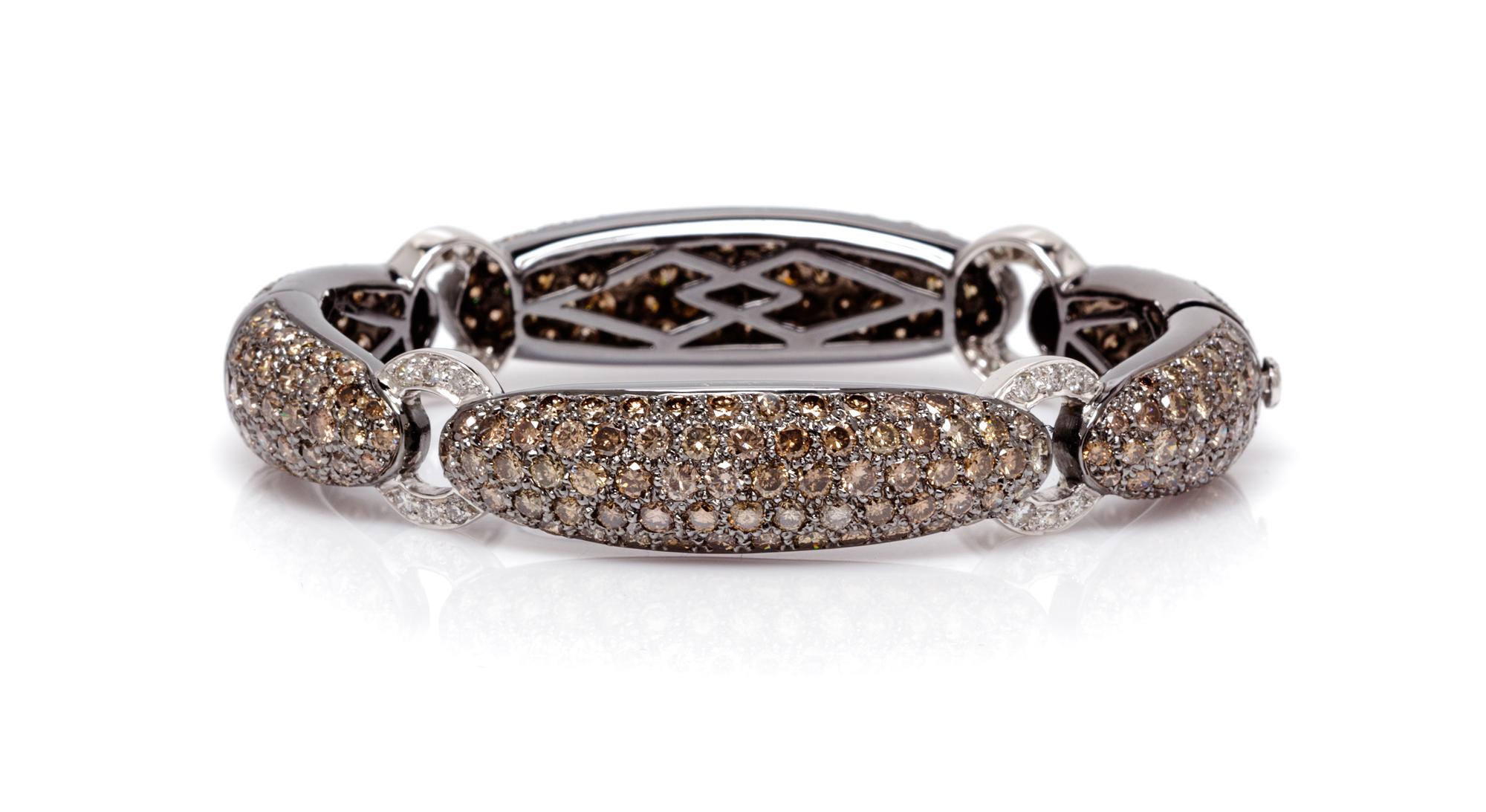 An 18 Karat White Gold, Colored Diamond and Diamond Bracelet, 30.10 dwts.
