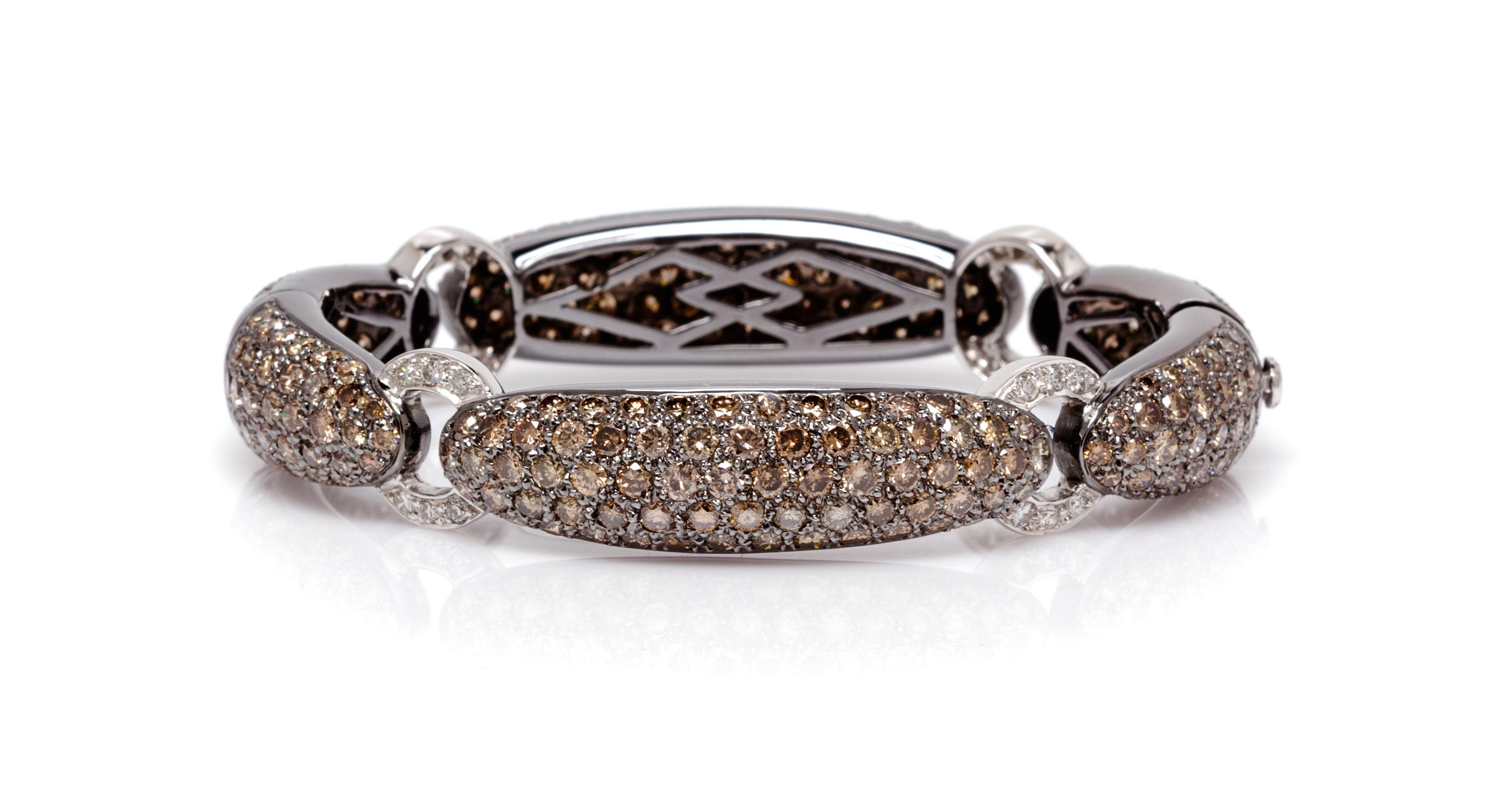 An 18 Karat White Gold, Colored Diamond and Diamond Bracelet, 30.10 dwts.
