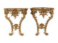 A Pair of Italian Baroque Giltwood Onyx-Top Console Tables