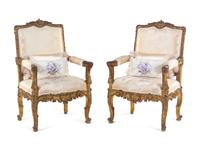 A Pair of Régence Style Carved Giltwood Fauteuils