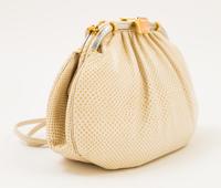 A Judith Leiber Ivory Snakeskin Clutch, 9.5" x 6" x 1.5".