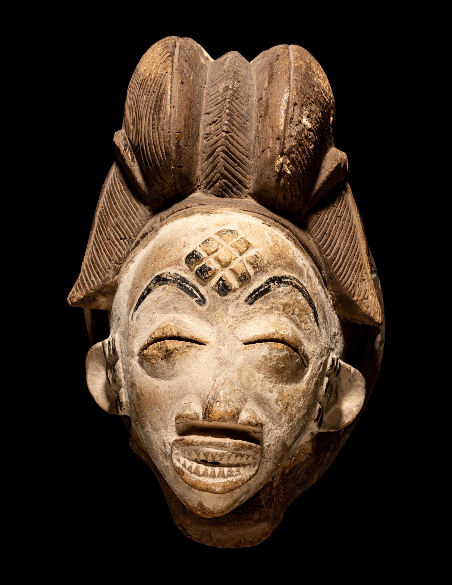 Four Punu Wood Masks