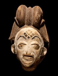 Four Punu Wood Masks