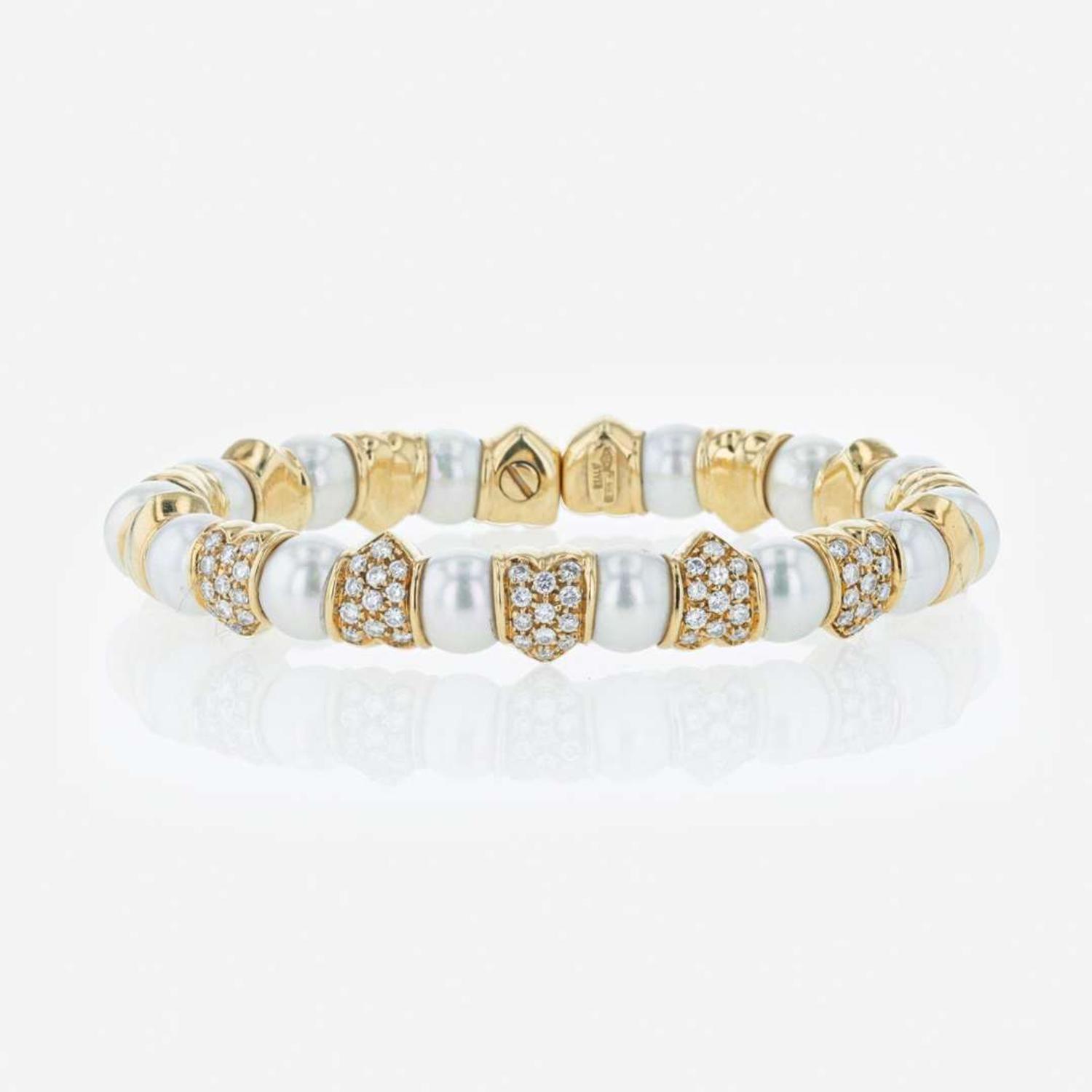An 18K yellow gold, cultured pearl, and diamond bangle Italy