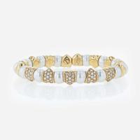 An 18K yellow gold, cultured pearl, and diamond bangle Italy