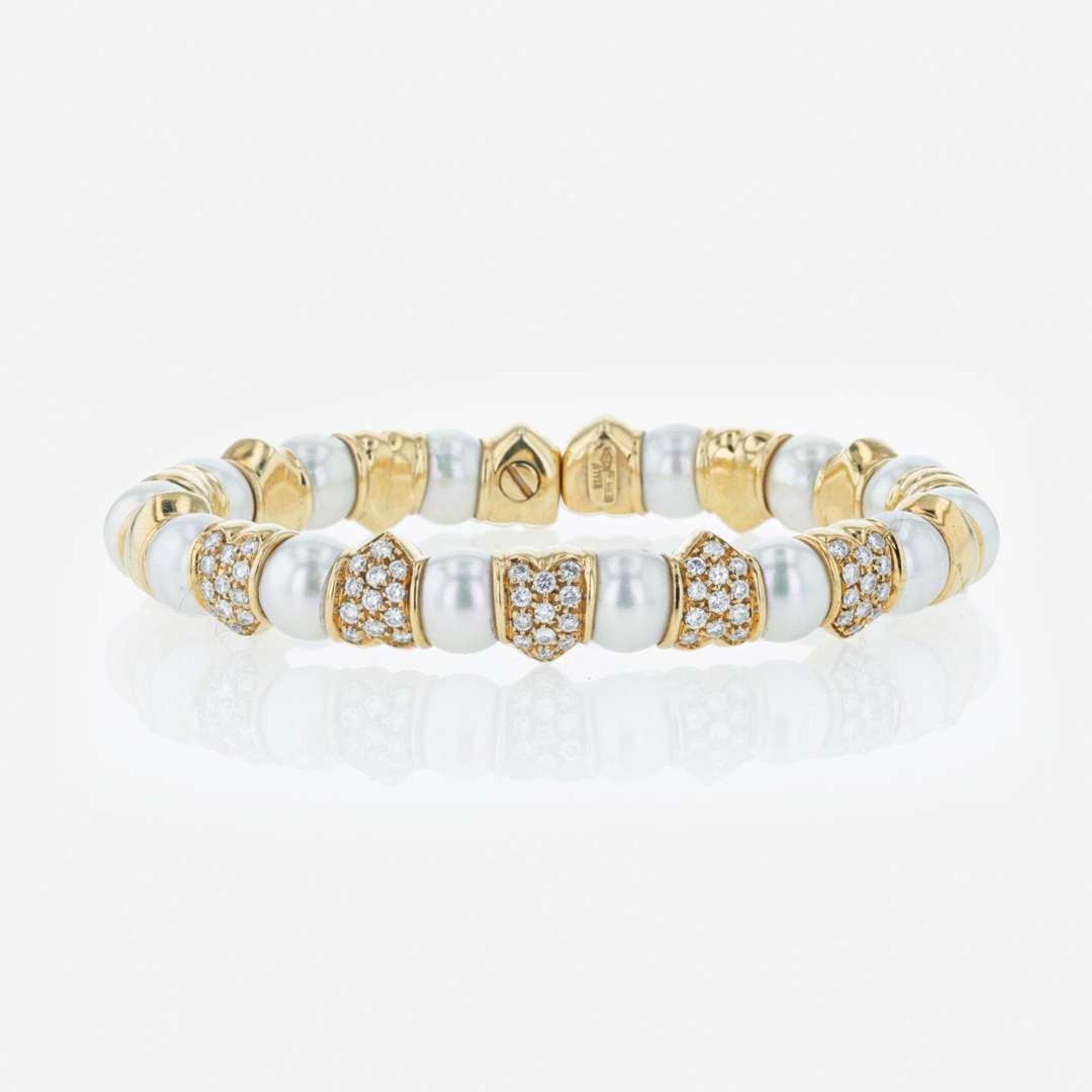 An 18K yellow gold, cultured pearl, and diamond bangle Italy