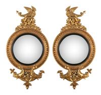 A Pair of Regency Carved Giltwood Convex Wall Mirrors