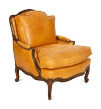 A Louis XVI Style Carved Mahogany Leather Upholstered Bergeré — 20th Century