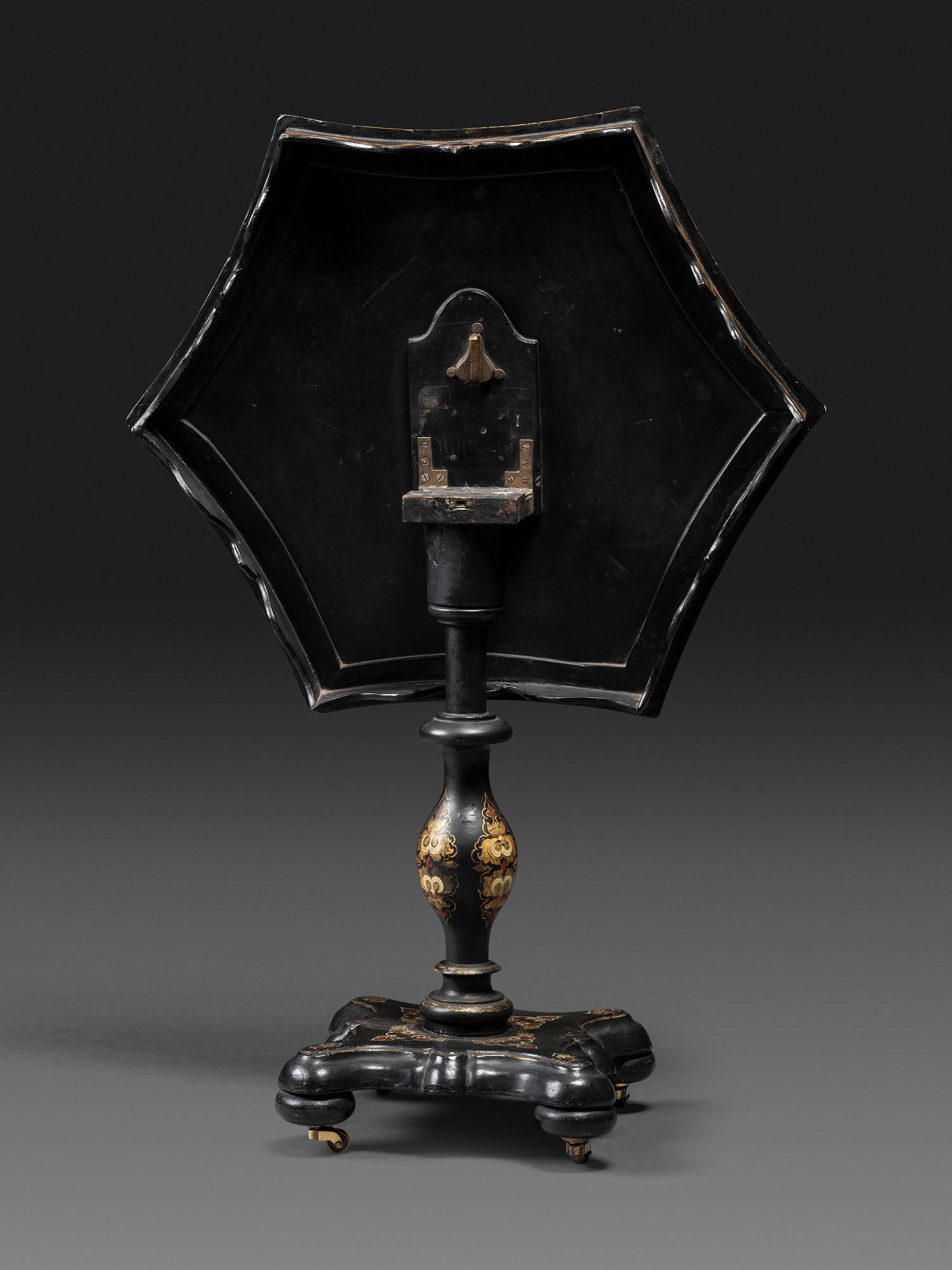 A Victorian Parcel-Gilt and Black Lacquered Mother-of-Pearl Inlaid Hexagonal Tilt-Top Tea Table