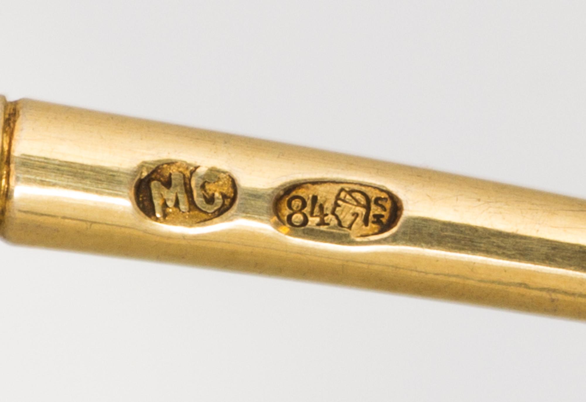 A Russian Silver-Gilt and Enamel Spoon, Mark of Maria Semenova, kokoshnik mark of Ivan Lebedkin, Moscow, having an enameled finial surm