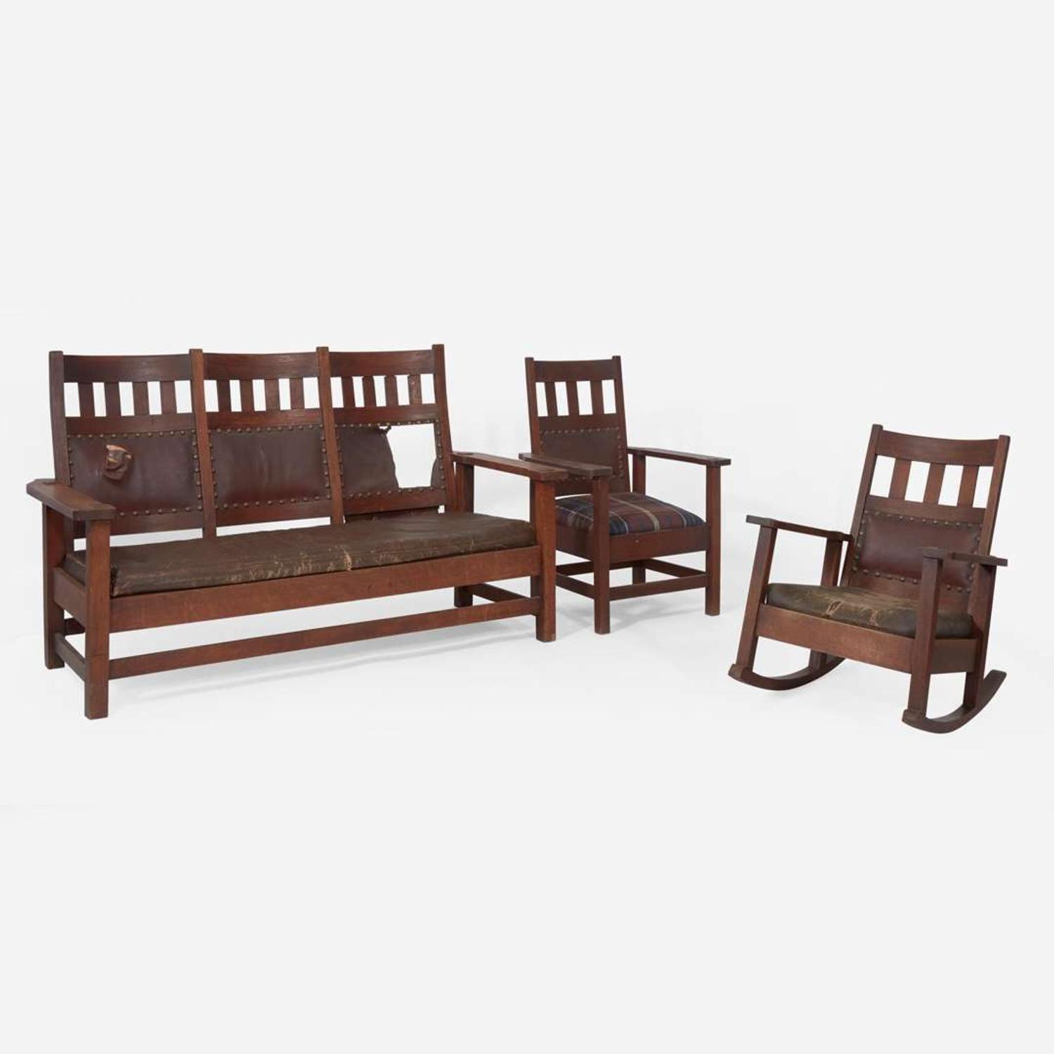Attributed to Stickley Brothers (American, active 1891-1954) A Settle, Armchair, and Rocking Chair, USA, circa 1905