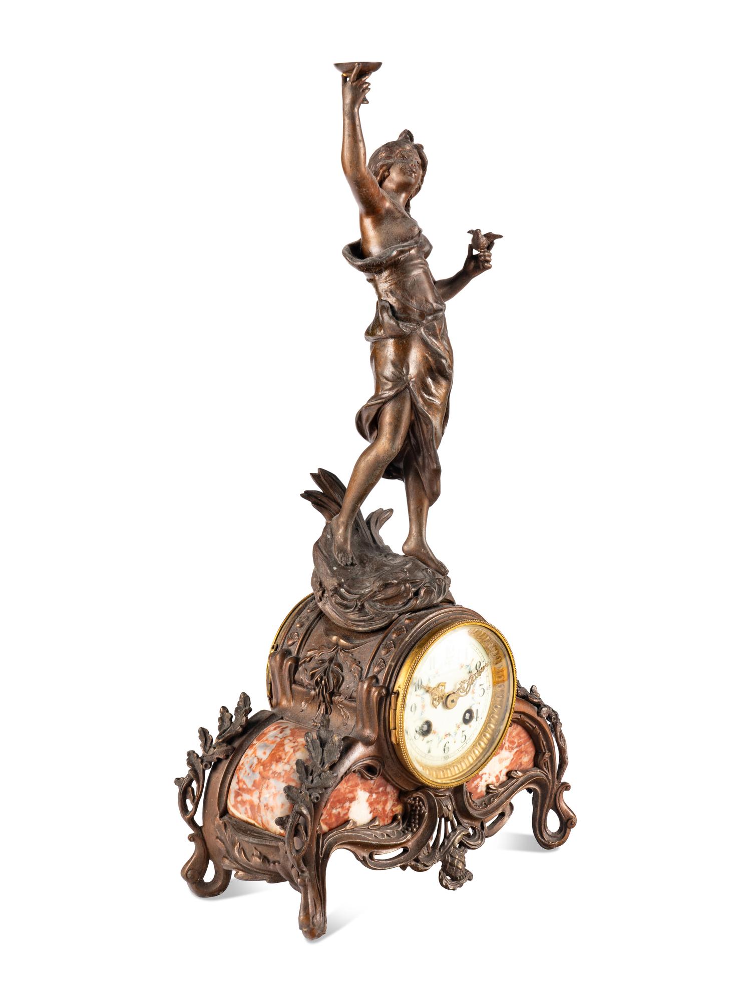 A French Cast Metal and Marble Figural Clock