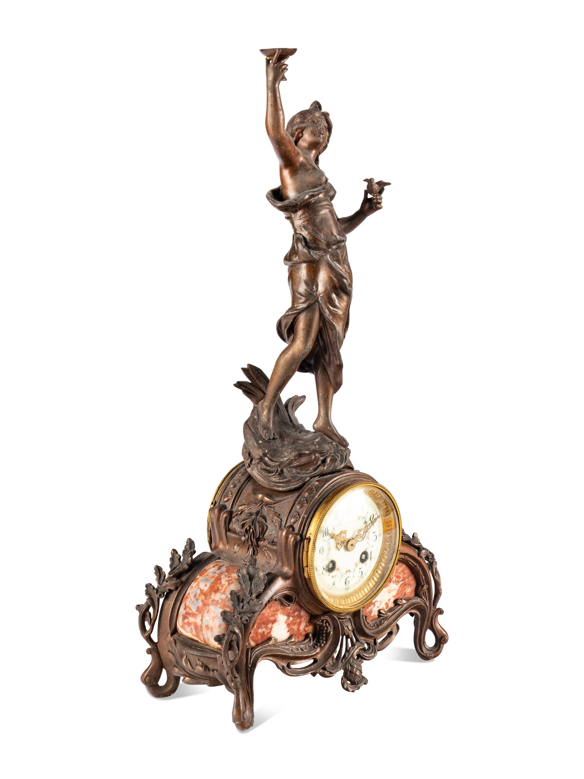 A French Cast Metal and Marble Figural Clock