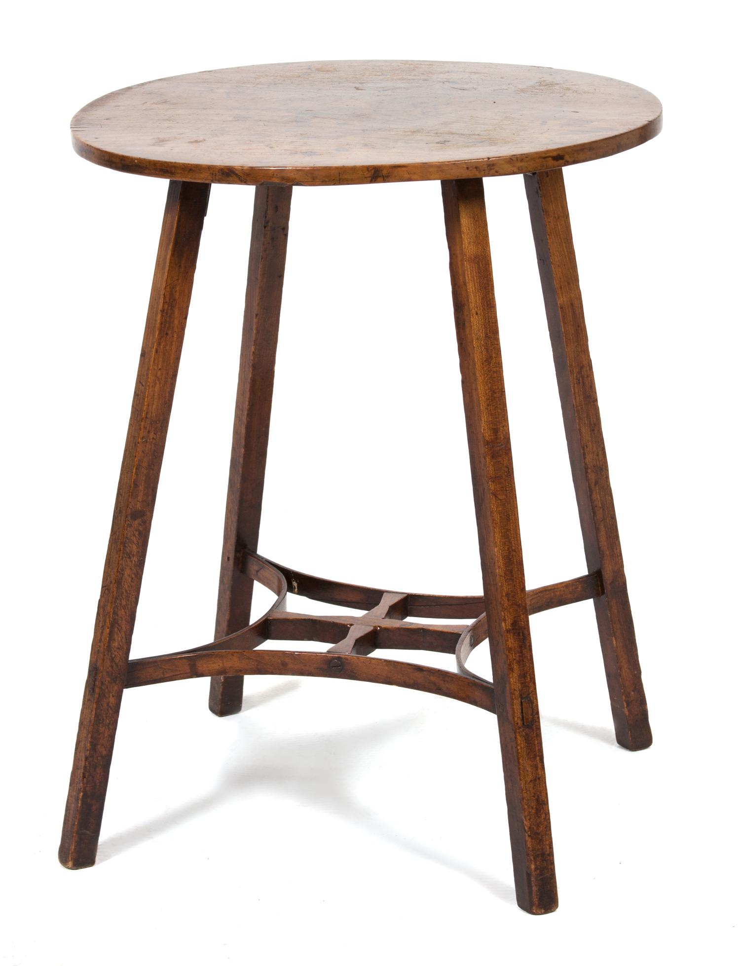 An Arts & Crafts Style Walnut Side Table Height 24 1/2 x diameter 19 1/2 inches. — 20TH CENTURY