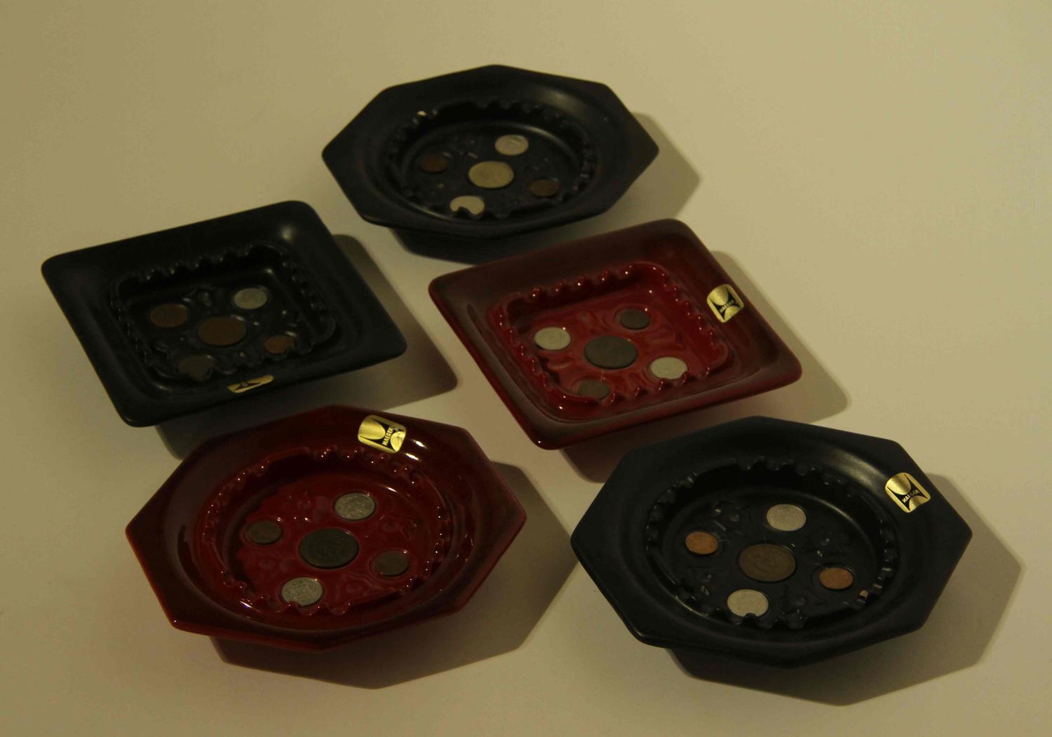A Collection of Commemorative Haeger Pottery Ash Receivers Width of widest 13 inches.