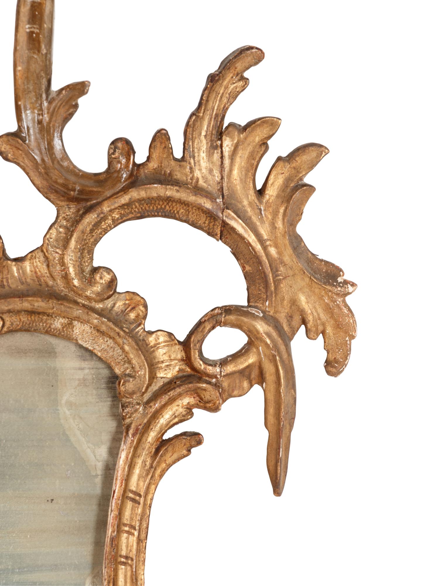 An Italian Baroque Style Giltwood Mirror