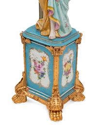 A Pair of German Porcelain and Gilt Bronze Figural Seven-Light Candelabra