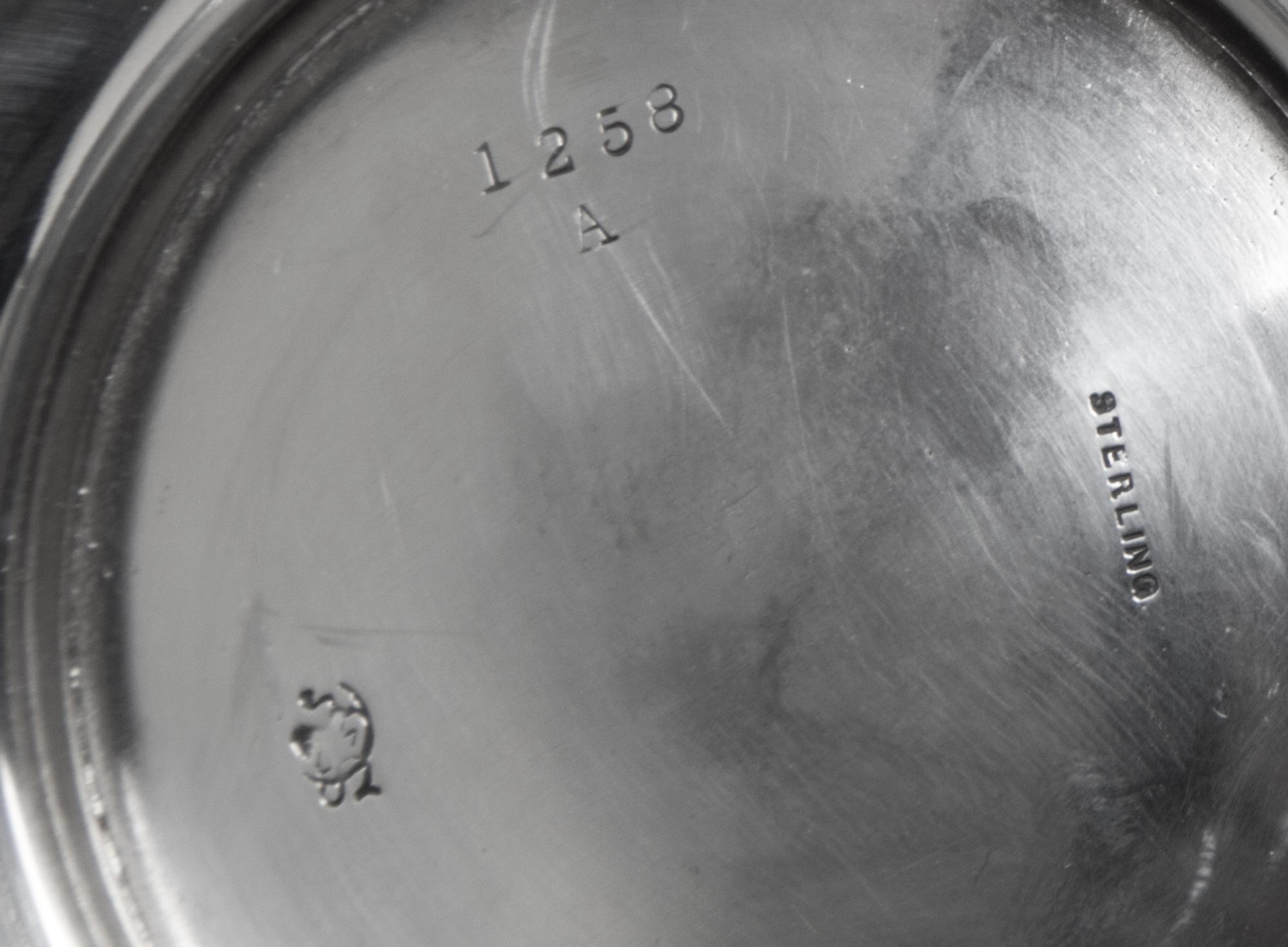 An American Silver Small Pitcher, Frank W. Smith Silver Co., Gardner, MA, of baluster form with a paneled lower body.