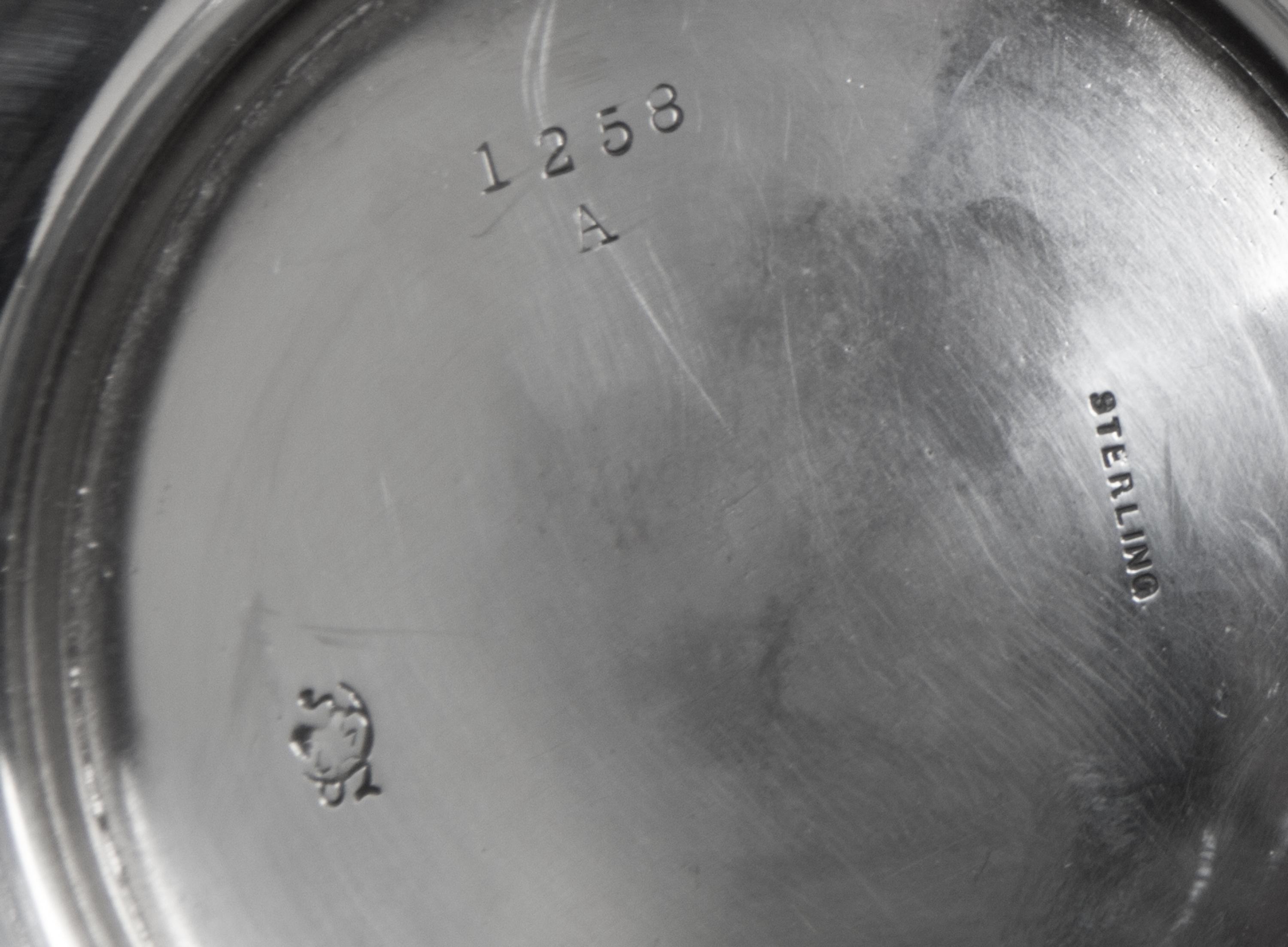 An American Silver Small Pitcher, Frank W. Smith Silver Co., Gardner, MA, of baluster form with a paneled lower body.