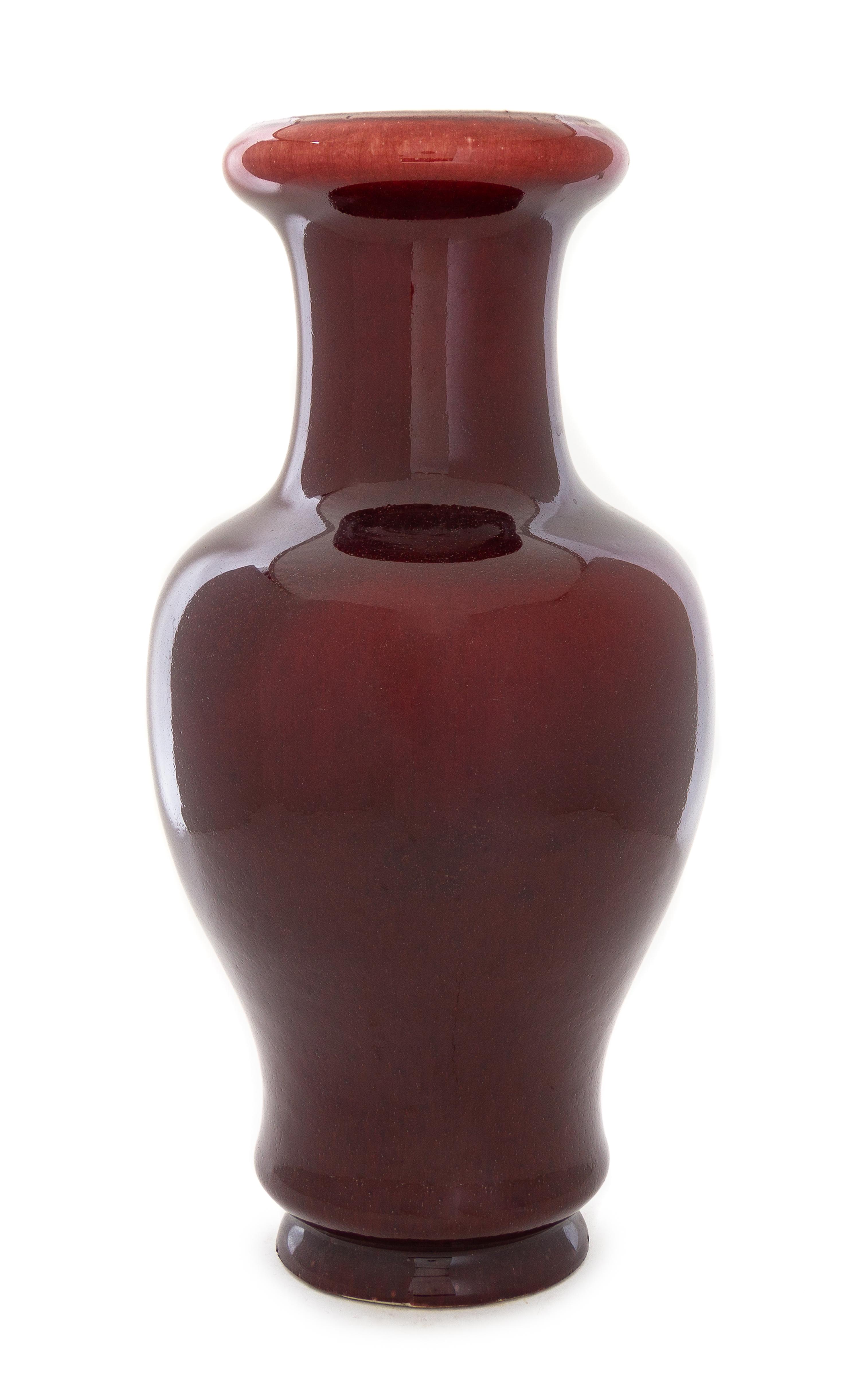 A Sang-de-Boeuf Glazed Porcelain Vase Height 16 3/4 inches.