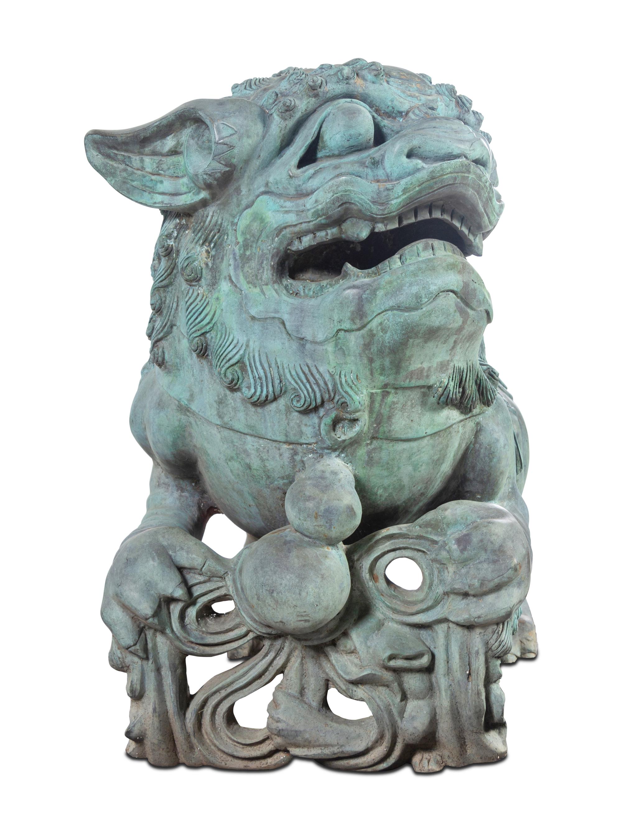 A Pair of Patinated Bronze Buddhistic Lions