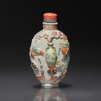 A Chinese Molded and Enameled "Bo Gu Tu" Porcelain Snuff Bottle, Qianlong Mark and of the Period — 1736-1795年 粉彩模印博古圖鼻煙壺