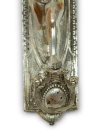 A Pair of Continental Silvered Metal Figural Wall Lights