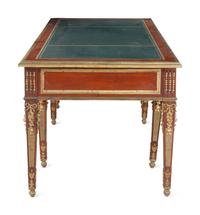 A Louis XVI Style Gilt Bronze Mounted Mahogany Bureau Plat After the Model by Guillaume Benneman