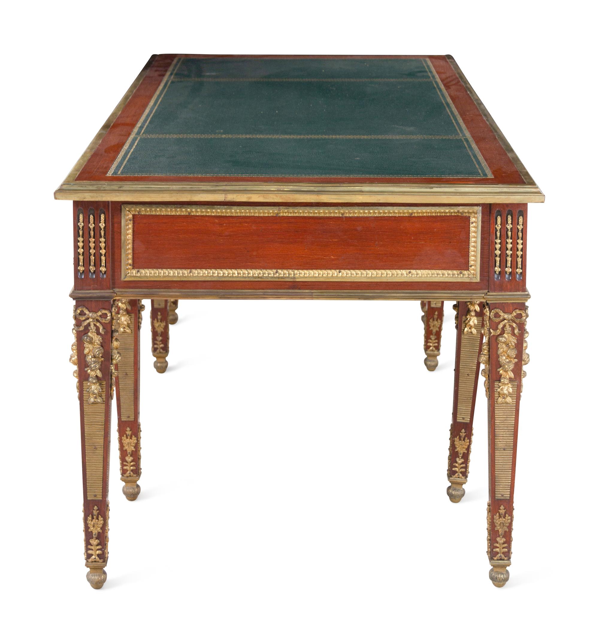 A Louis XVI Style Gilt Bronze Mounted Mahogany Bureau Plat After the Model by Guillaume Benneman