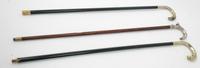 Three Silver Handled Walking Canes Height of tallest 37 1/2 inches.