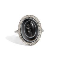 A Roman Banded Agate Ring Stone with the Infant Eros Holding a Butterfly — Set in a silver ring