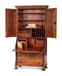 A Classical Style Carved and Highly Figured Tiger Maple Slant Front Desk