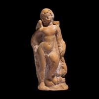 A Greek Terracotta Eros Holding a Club