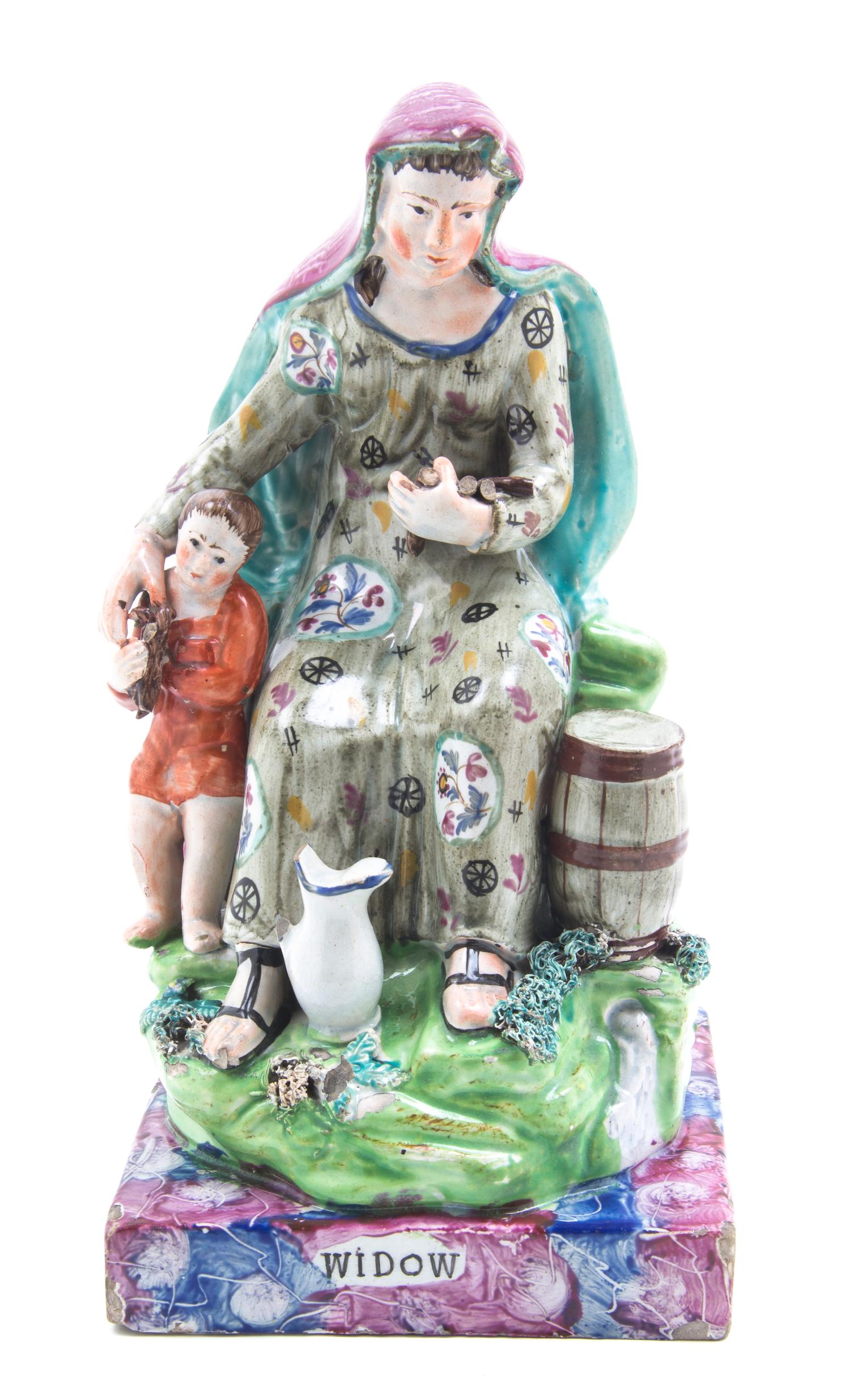 An English Porcelain Figural Group, Height 9 1/2 inches.