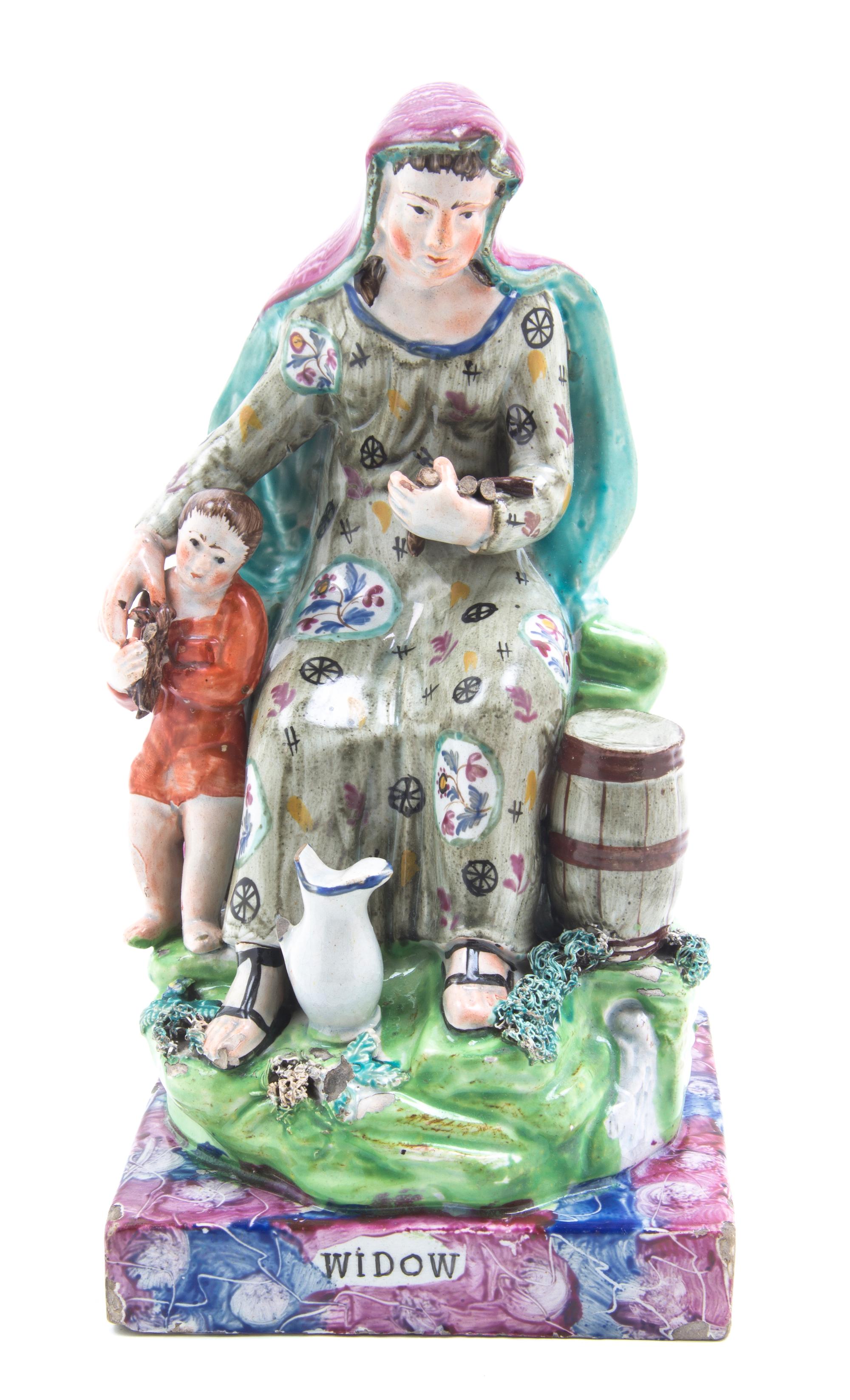 An English Porcelain Figural Group, Height 9 1/2 inches.