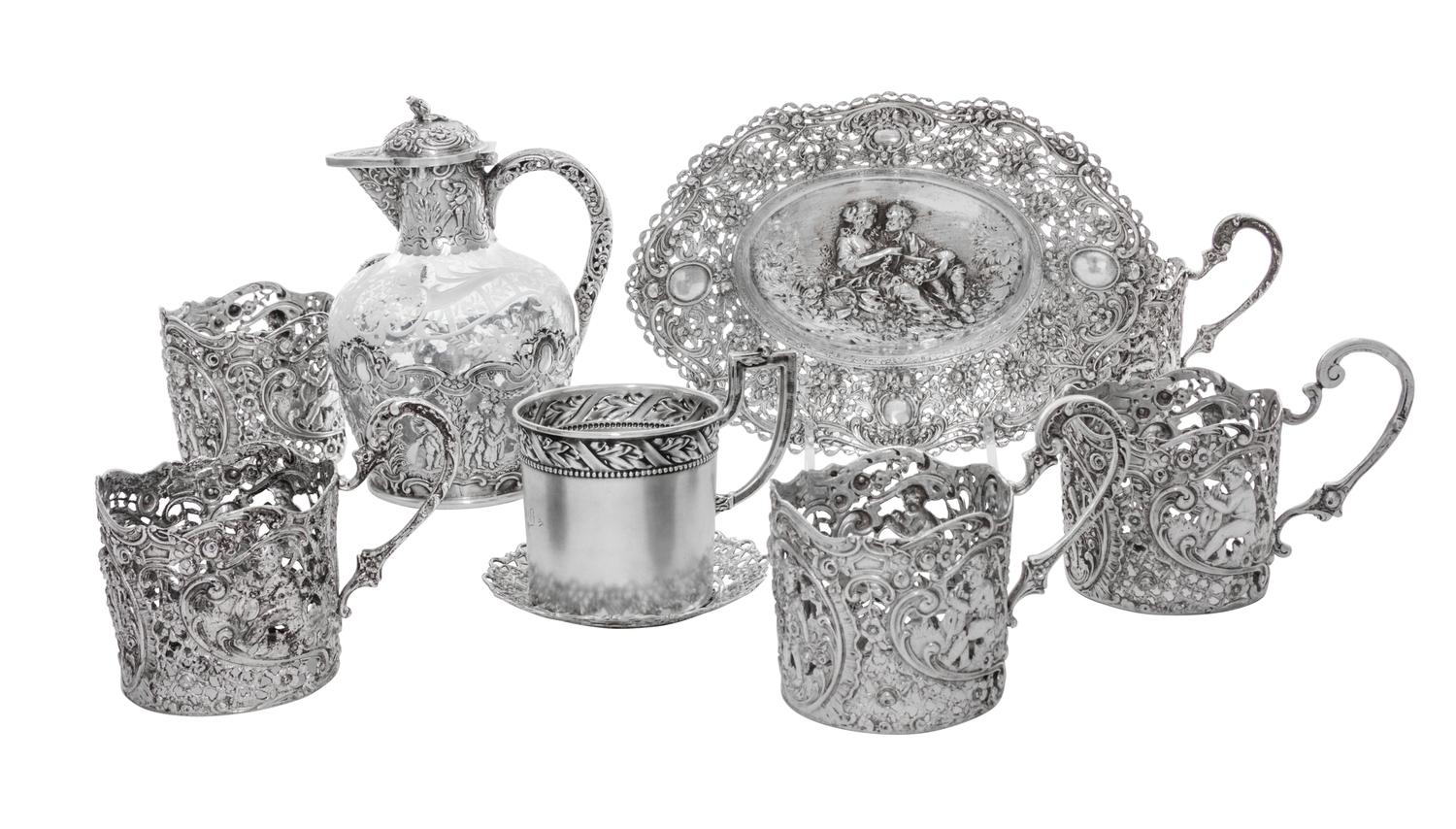 A Collection of German Silver Articles, 19th/20th Century, comprising five cups (lacking liners), an oval dish with figural decoration,
