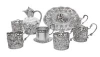 A Collection of German Silver Articles, 19th/20th Century, comprising five cups (lacking liners), an oval dish with figural decoration,