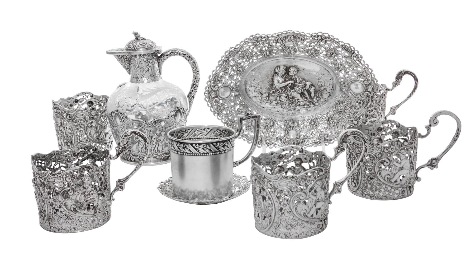 A Collection of German Silver Articles, 19th/20th Century, comprising five cups (lacking liners), an oval dish with figural decoration,