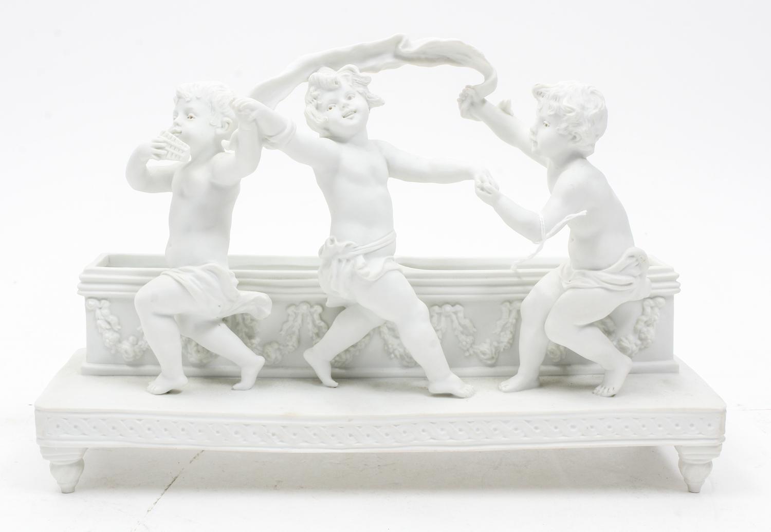 A Continental Bisque Porcelain Jardiniere Width 12 3/8 inches.