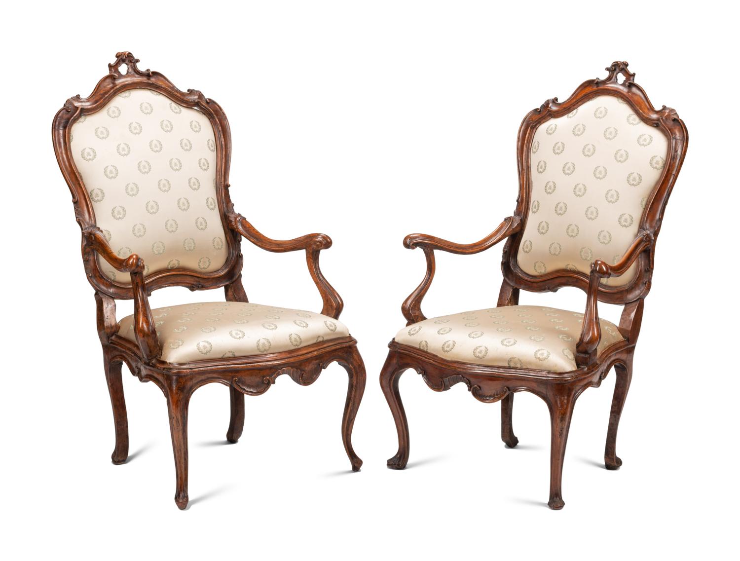 A Pair of Venetian Carved Walnut Armchairs