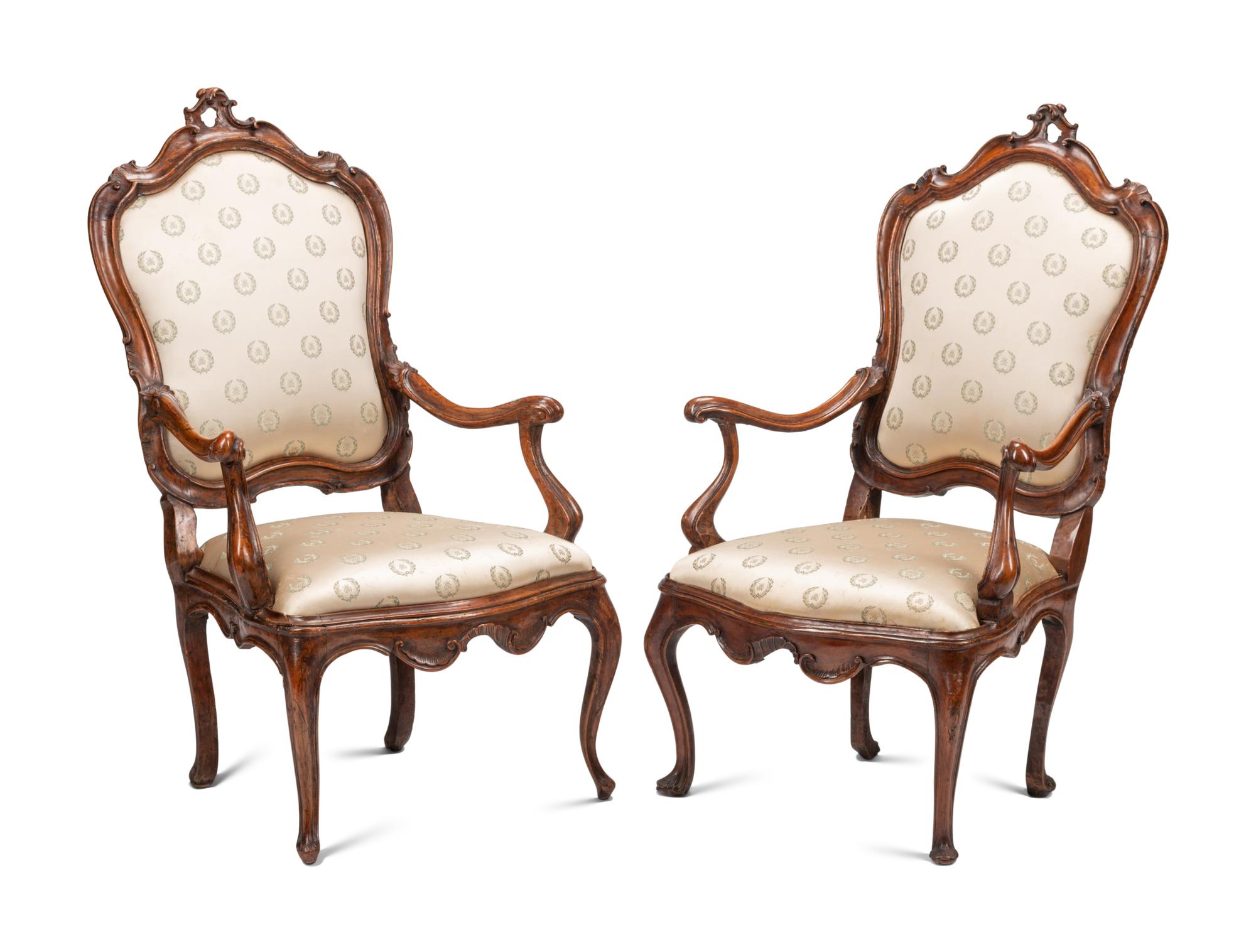 A Pair of Venetian Carved Walnut Armchairs