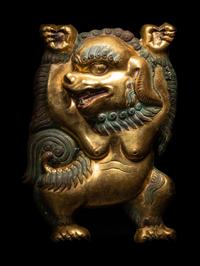 A Sino-Tibetan Gilt Bronze Repoussé Fu-Lion