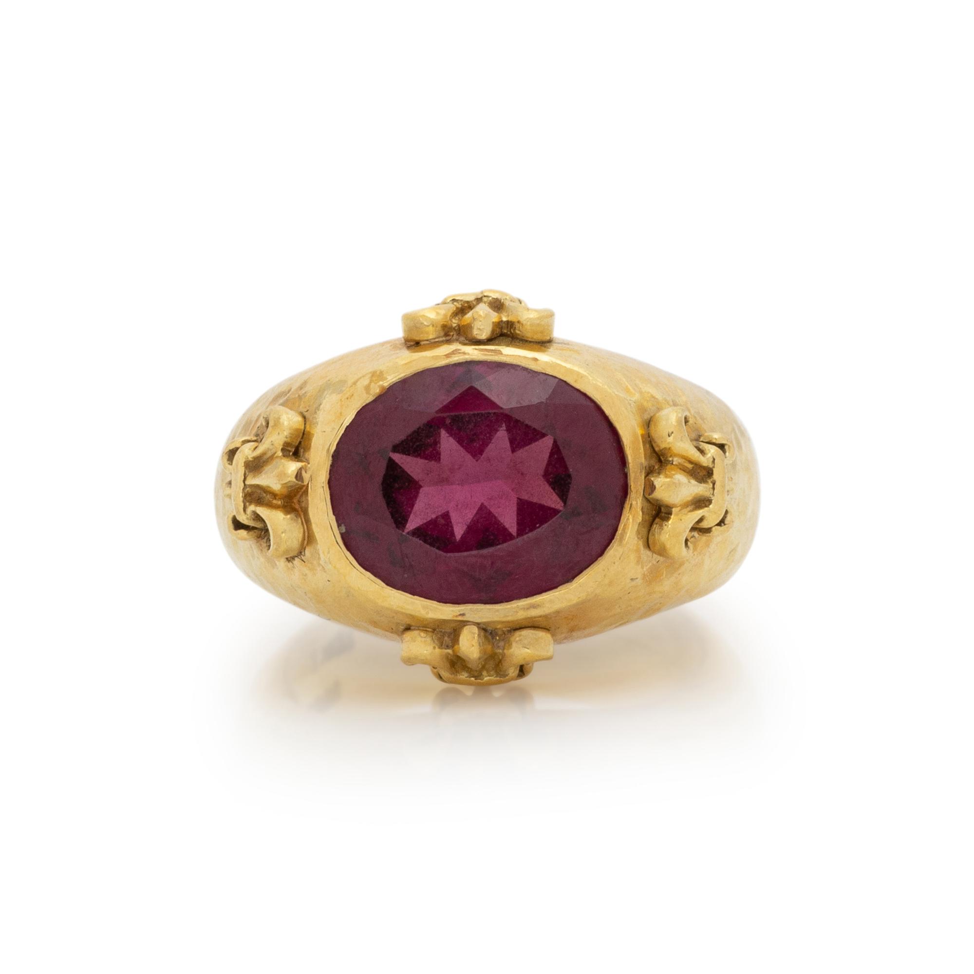 MAZ, YELLOW GOLD AND GARNET RING