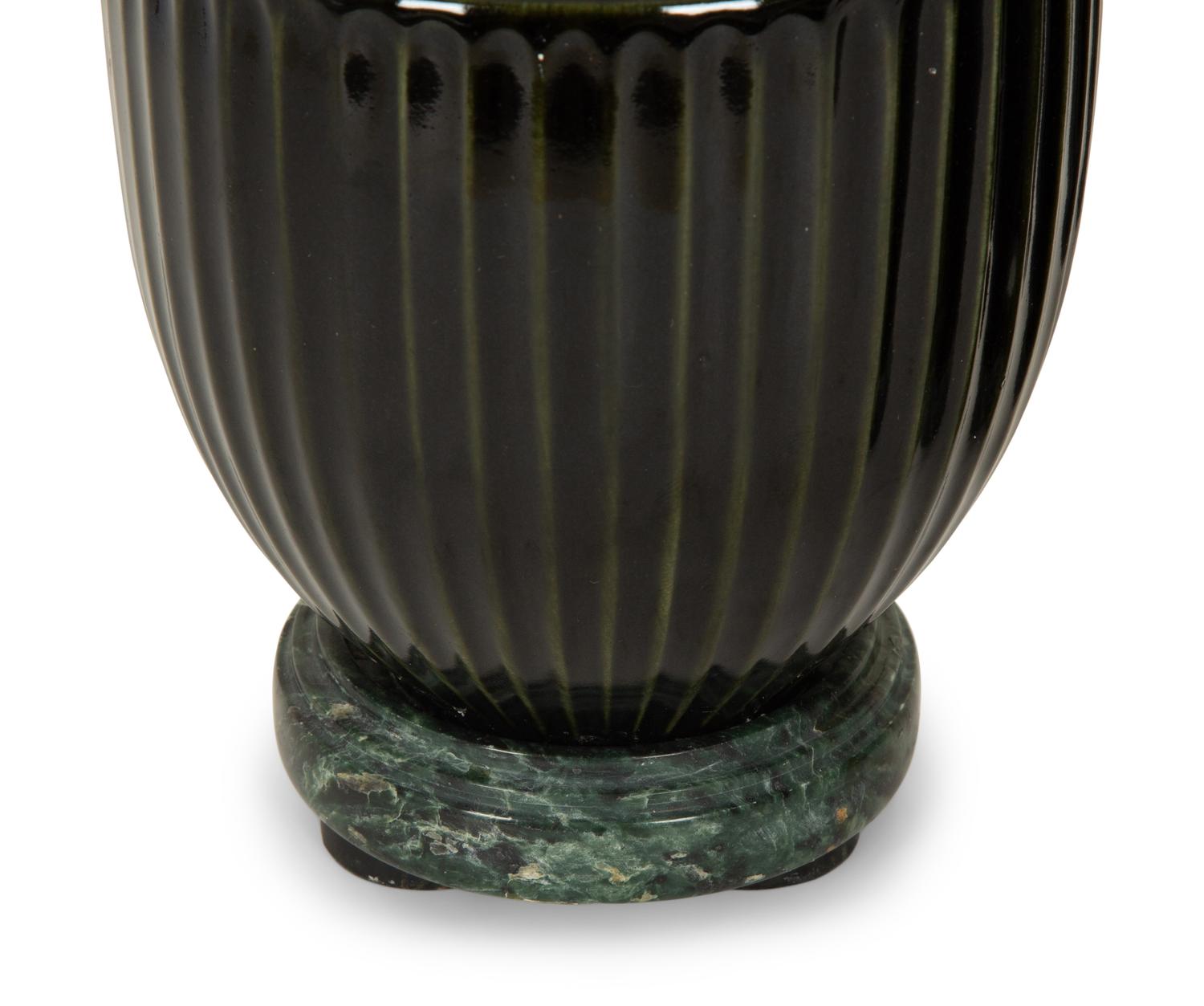 A Pair of Black Porcelain Urns on Green Marbelized Bases
