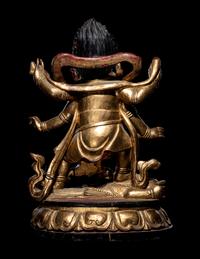 A Large Sino-Tibetan Gilt and Red Lacquered Wood Figure of a Mahākāla