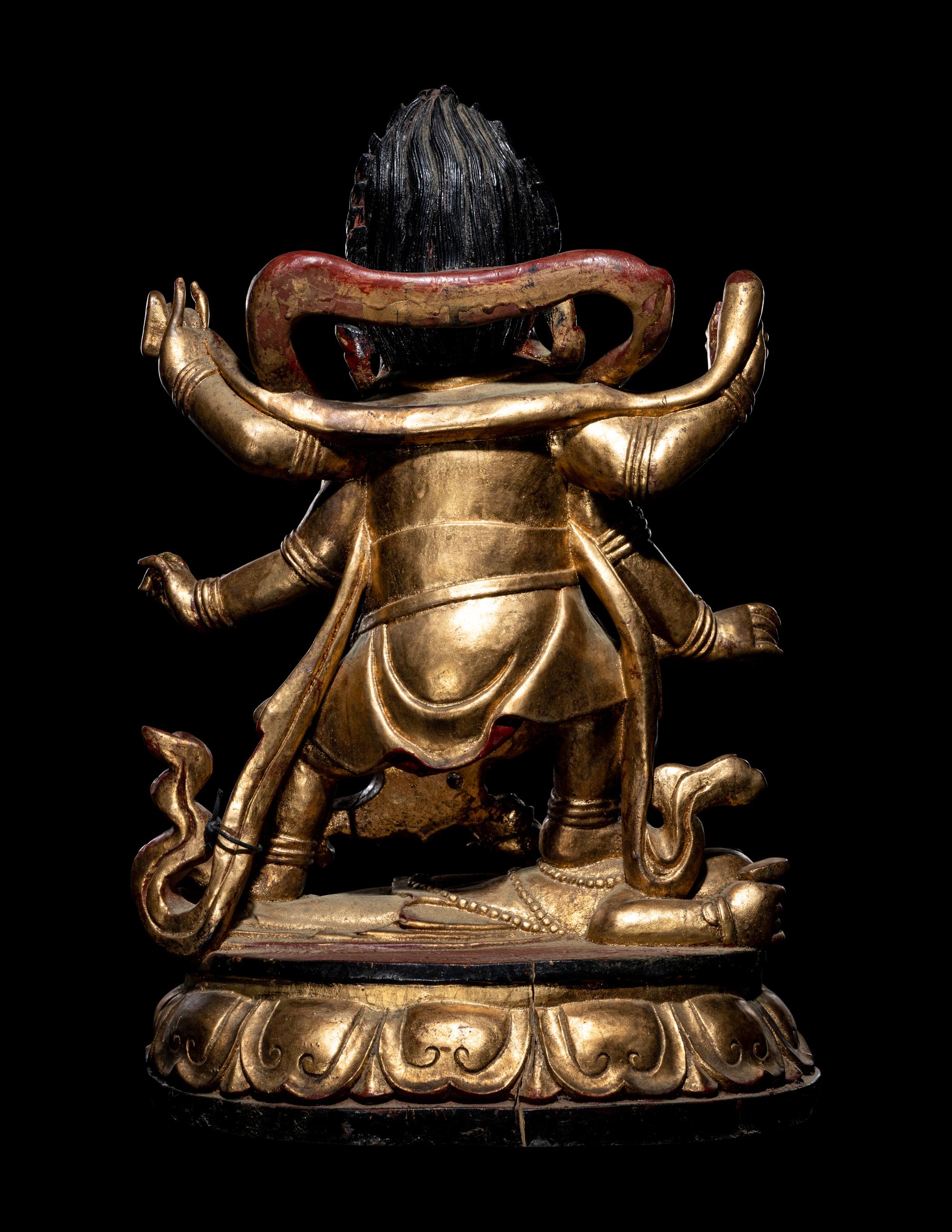 A Large Sino-Tibetan Gilt and Red Lacquered Wood Figure of a Mahākāla