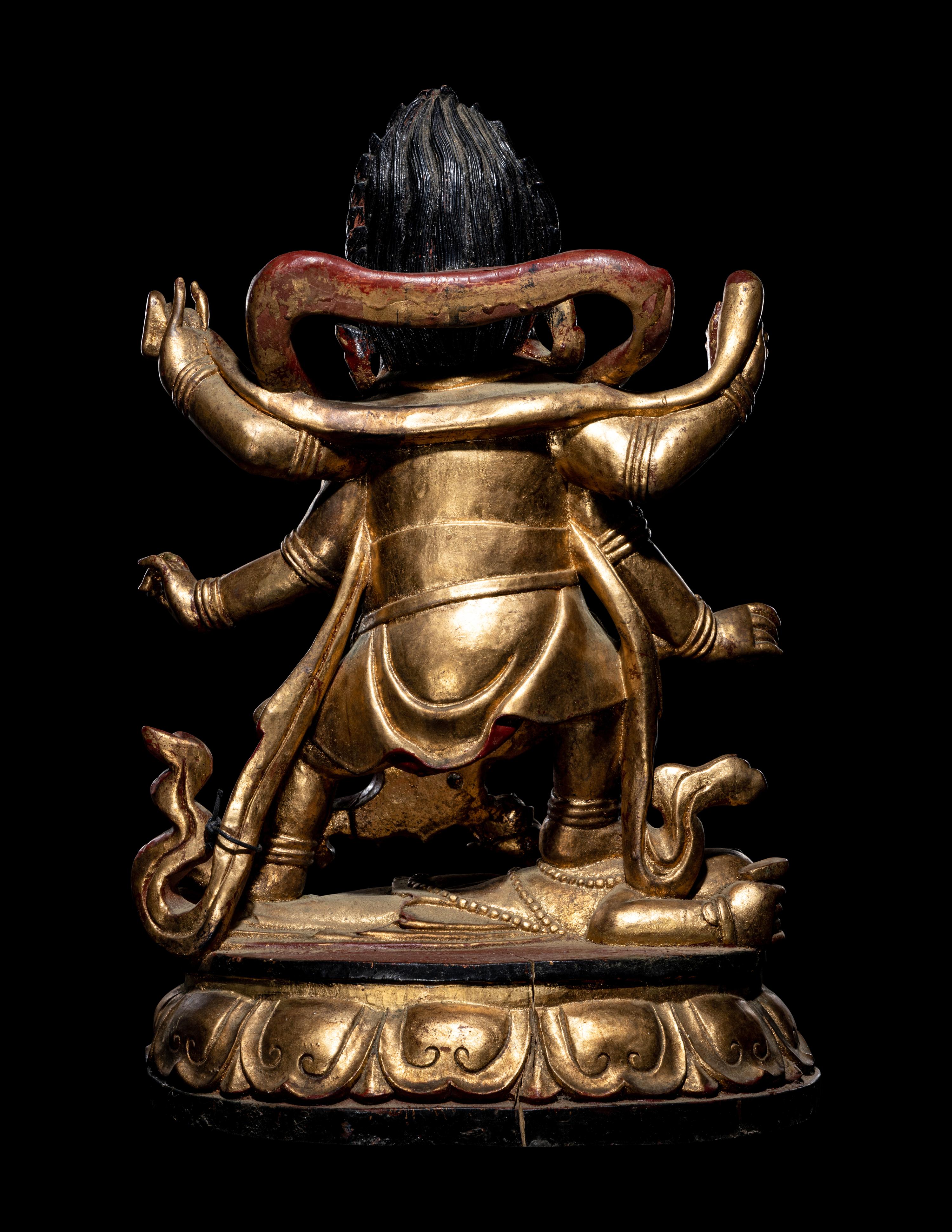 A Large Sino-Tibetan Gilt and Red Lacquered Wood Figure of a Mahākāla