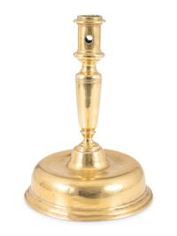 A Continental Brass Bell-Bottom Candlestick