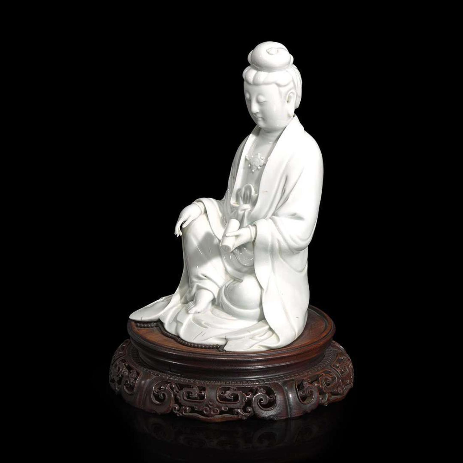 A Chinese blanc de Chine figure of Guanyin seated, with scroll 白瓷持卷轴观音像 Boji Yuren mark ?????